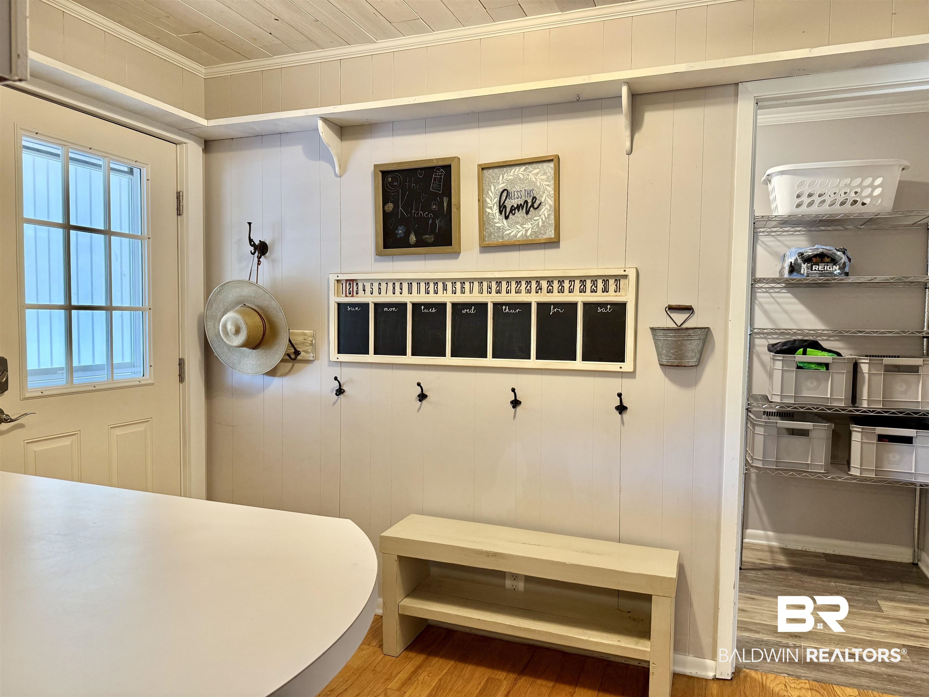 2785 Appleton Road Brewton, AL 36426 - Photo 7 of 28 Mudroom featuring ornamental molding, light wood-type flooring, and wood walls