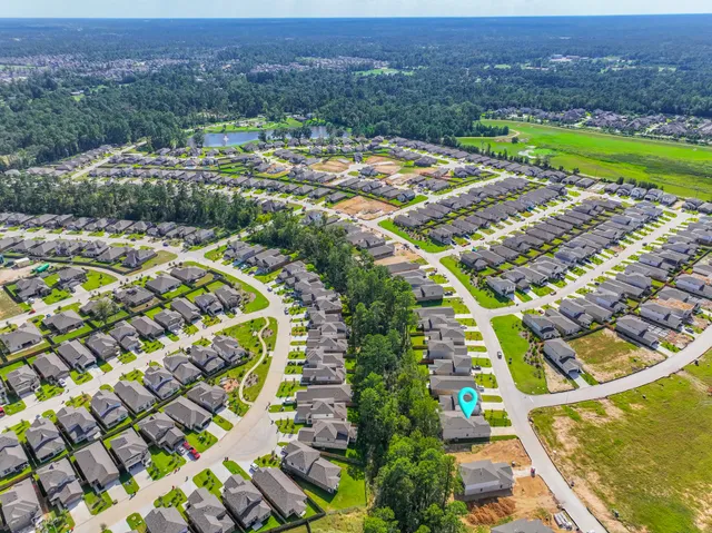 an aerial view of residential houses and outdoor space