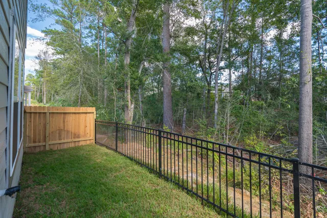 a view of house with backyard outdoor seating