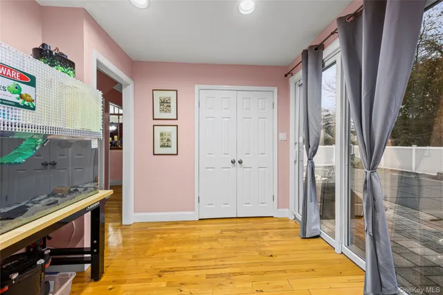a living room with furniture a flat screen tv and a table