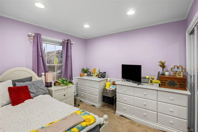 a bedroom with a workspace