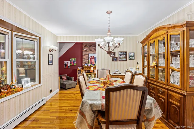 a living room with patio furniture and a flat screen tv
