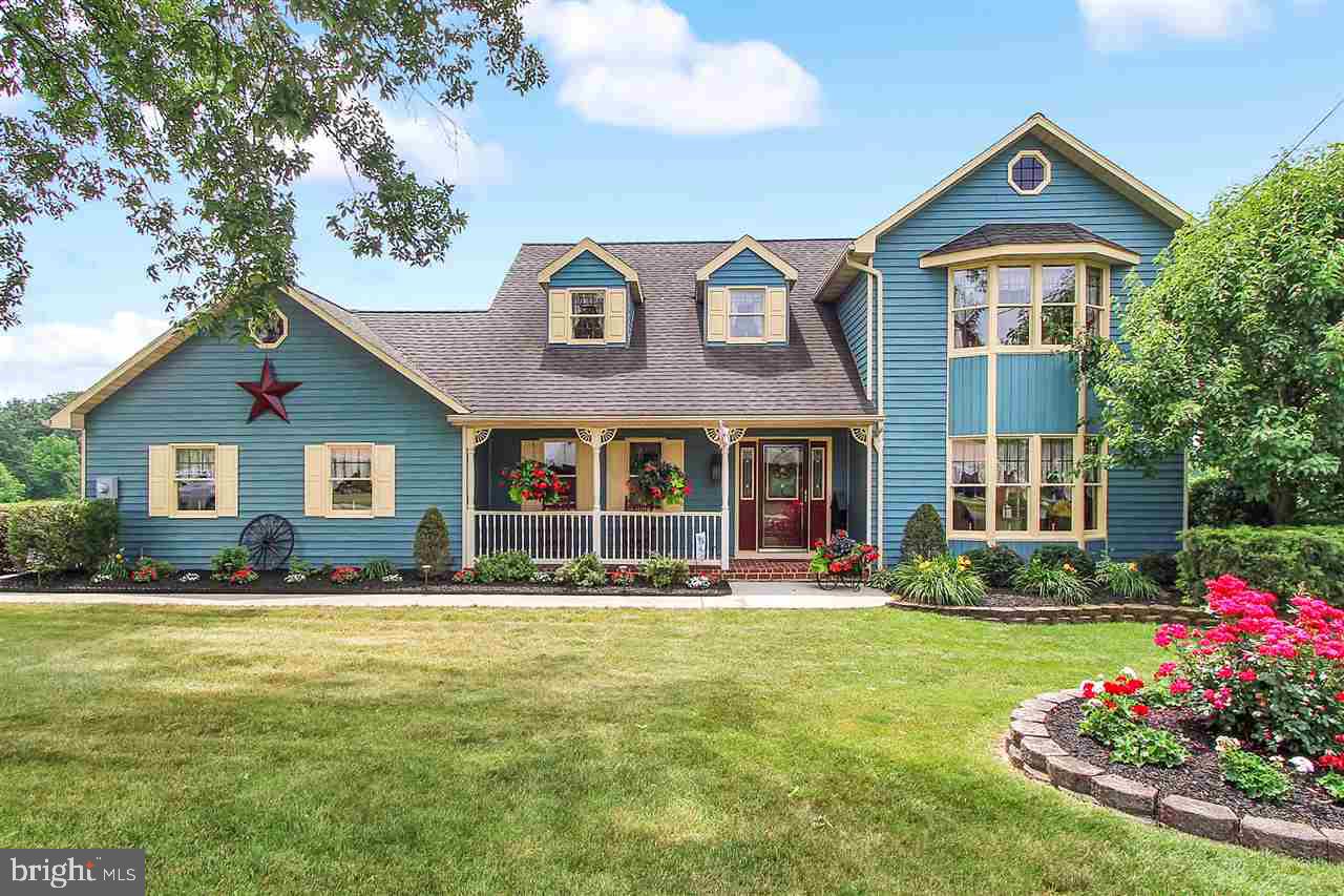 5650 Lischeys Church Road Spring Grove, PA 17362 - Photo 1 of 36 a front view of house and yard with green space