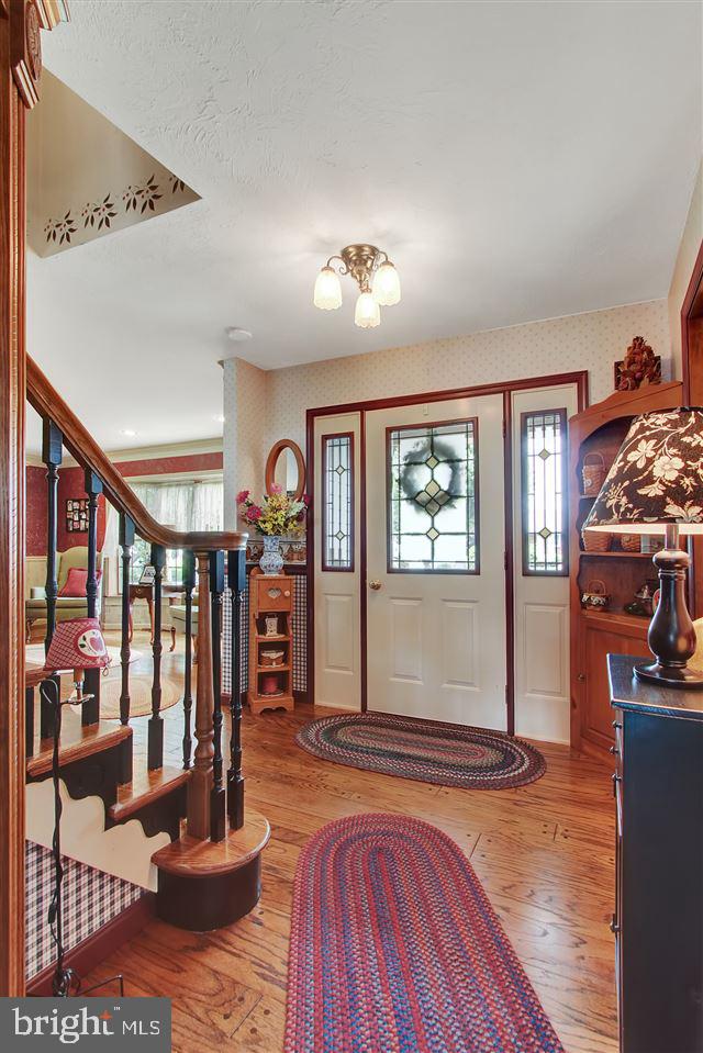 5650 Lischeys Church Road Spring Grove, PA 17362 - Photo 2 of 36 a view of a livingroom with furniture and hardwood floor