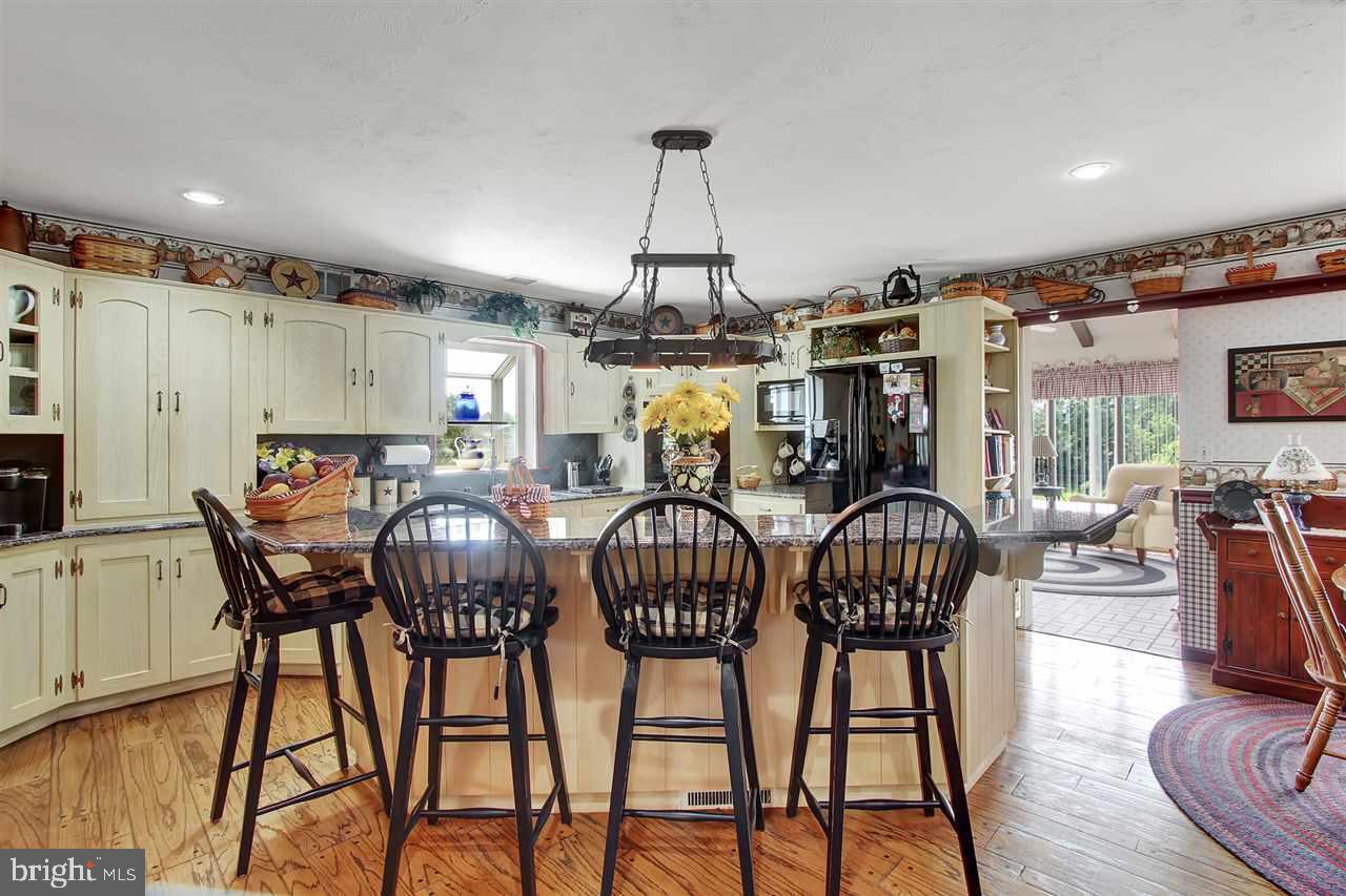 5650 Lischeys Church Road Spring Grove, PA 17362 - Photo 11 of 36 a view of a dining room with furniture window and wooden floor