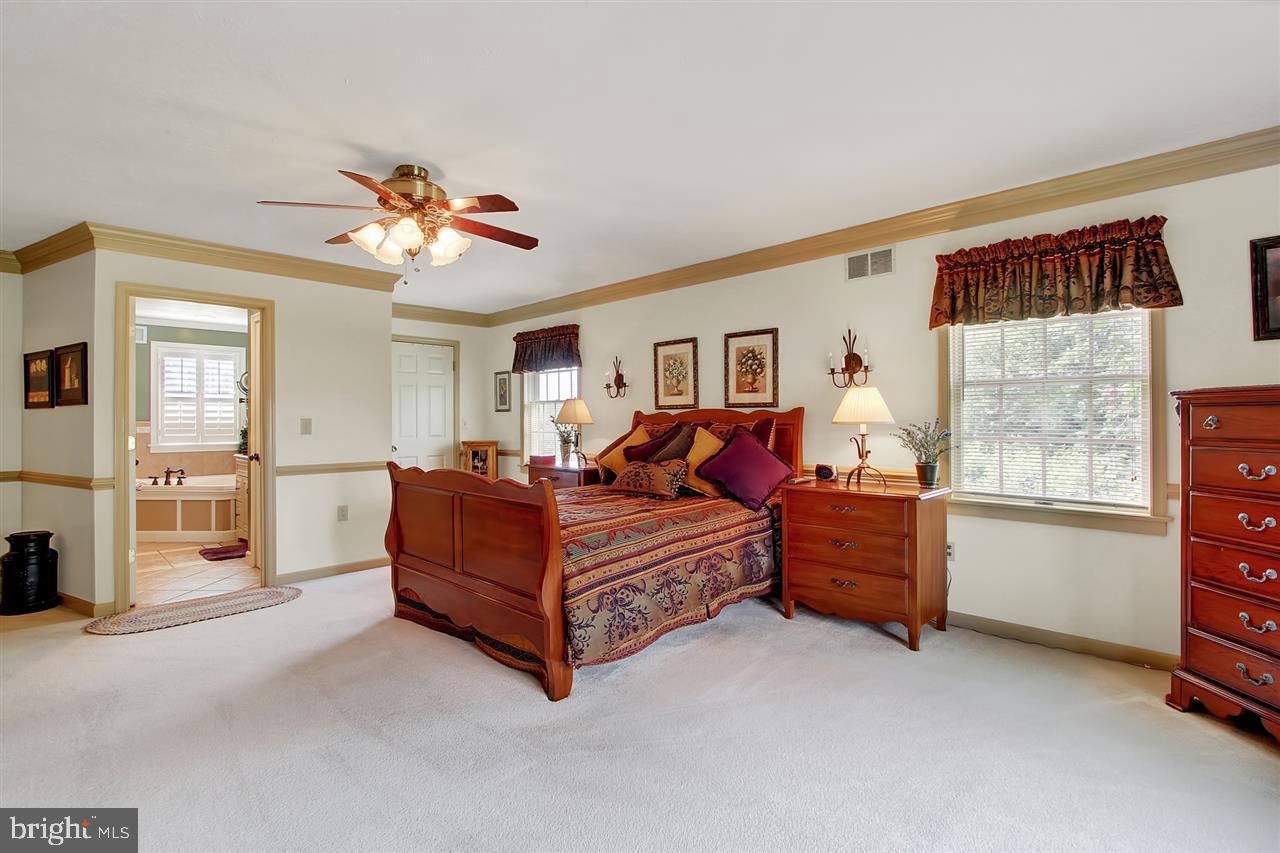 5650 Lischeys Church Road Spring Grove, PA 17362 - Photo 20 of 36 a living room with furniture and a chandelier