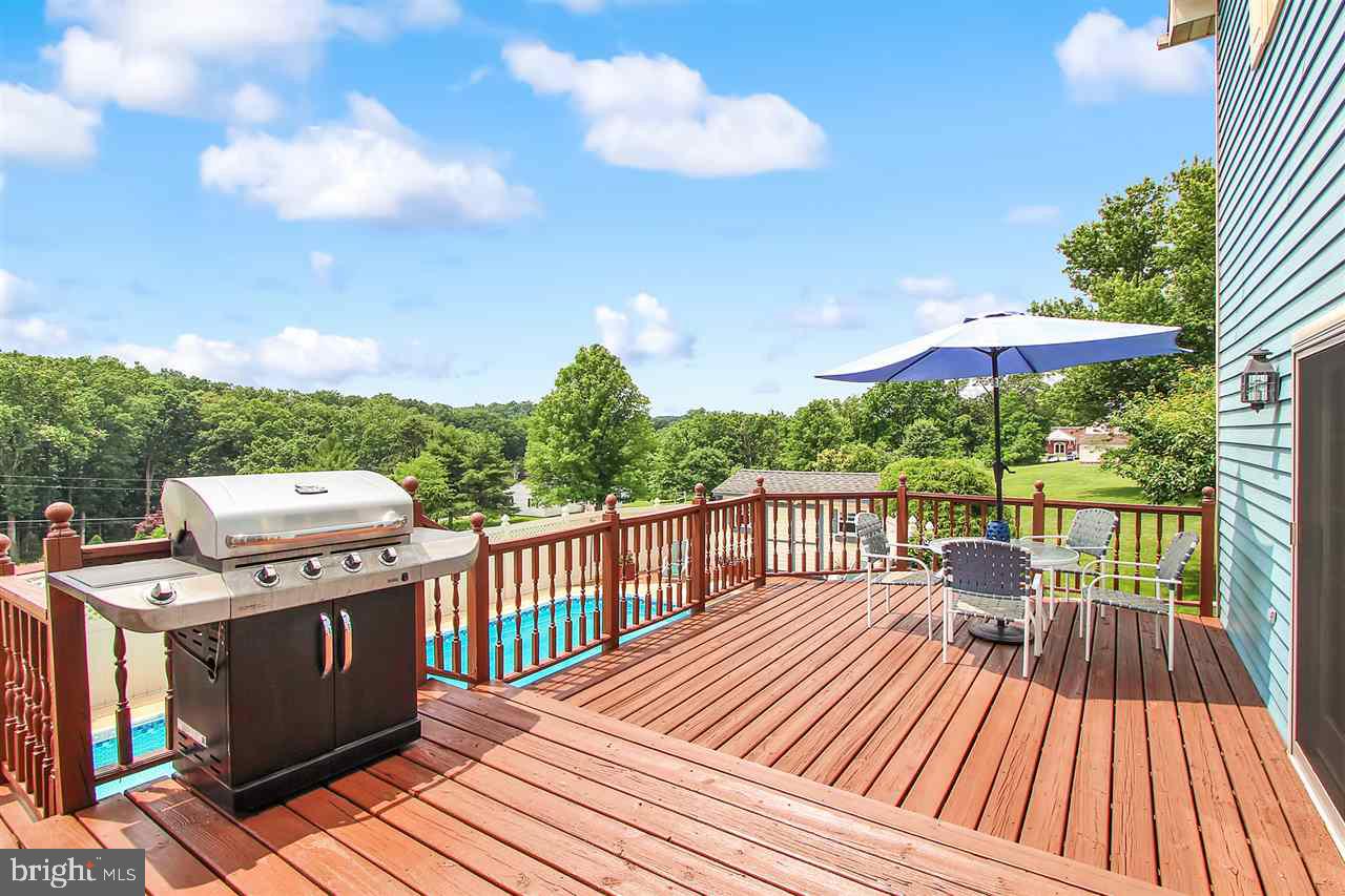 5650 Lischeys Church Road Spring Grove, PA 17362 - Photo 30 of 36 a view of a deck with wooden floor and barbeque oven