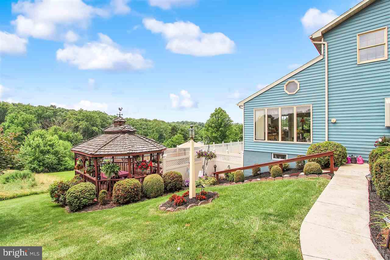 5650 Lischeys Church Road Spring Grove, PA 17362 - Photo 34 of 36 a view of an house with backyard space and sitting area
