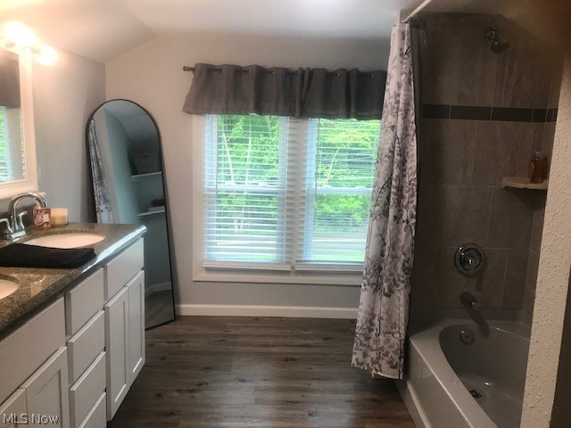 4652 South Turner Road Canfield, OH 44406 - Photo 17 of 28 Bathroom with dual bowl vanity, hardwood / wood-style floors, plenty of natural light, and vaulted ceiling