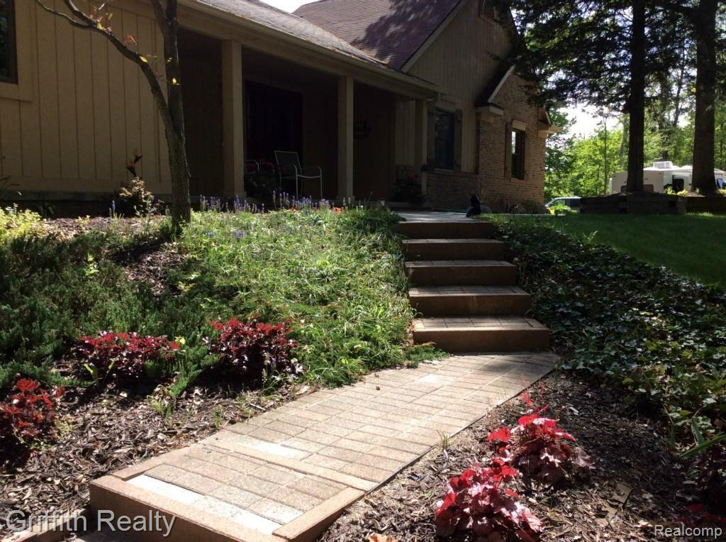 2051 Hidden Valley Howell, MI 48843 - Photo 59 of 66 Beautiful landscaping to front door.