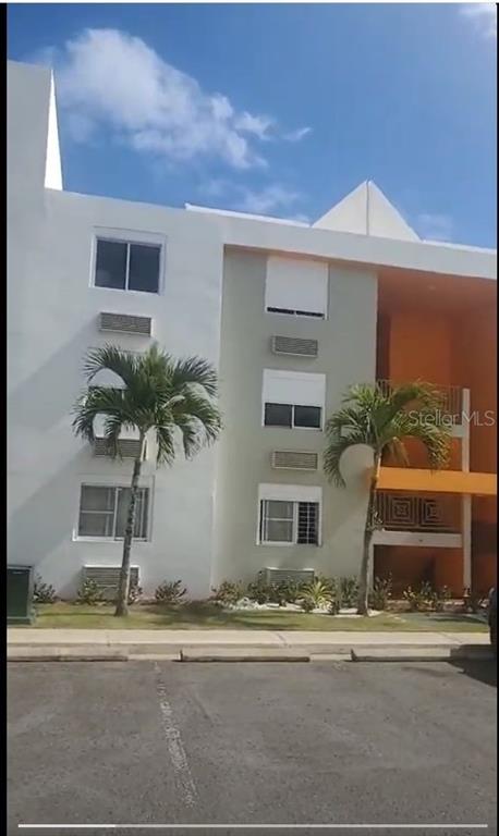 1 Tierra Del Sol, Unit 200 Humacao, PR 00791 - Photo 1 of 1 a front view of house with a yard