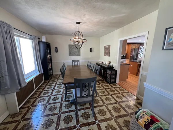 a living room with lots of furniture and a chandelier