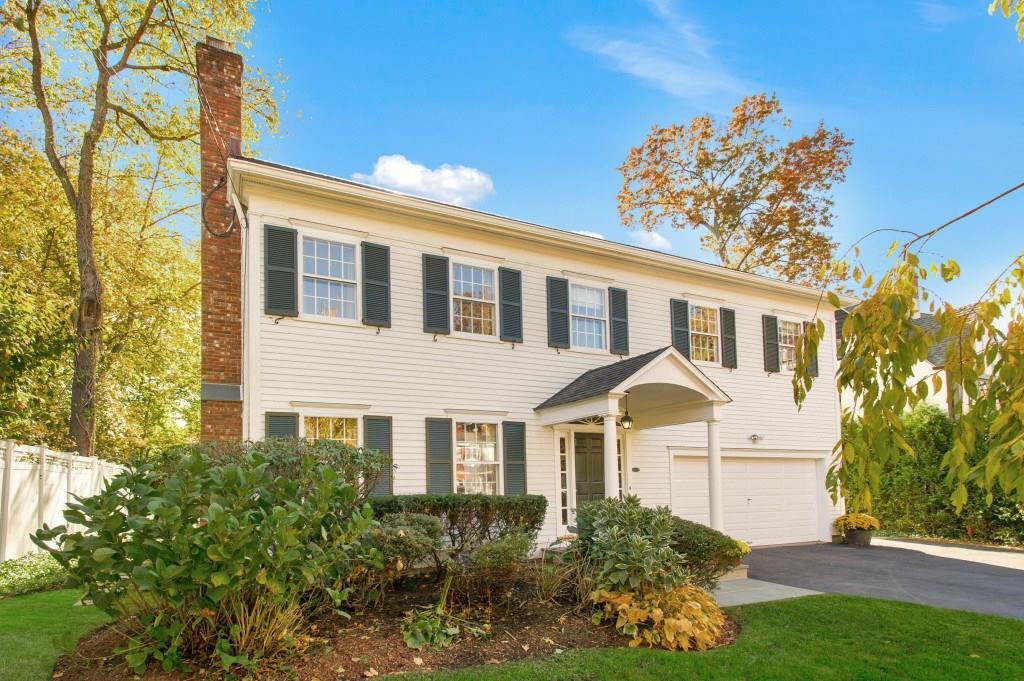 70 Summit Road Greenwich, CT 06878 - Photo 1 of 1 a front view of a house with a yard and potted plants