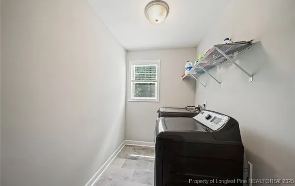 a view of storage and utility room with windows