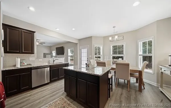 a kitchen with lots of counter top space and dining table