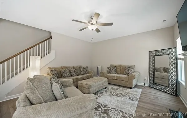 a living room with furniture and a rug
