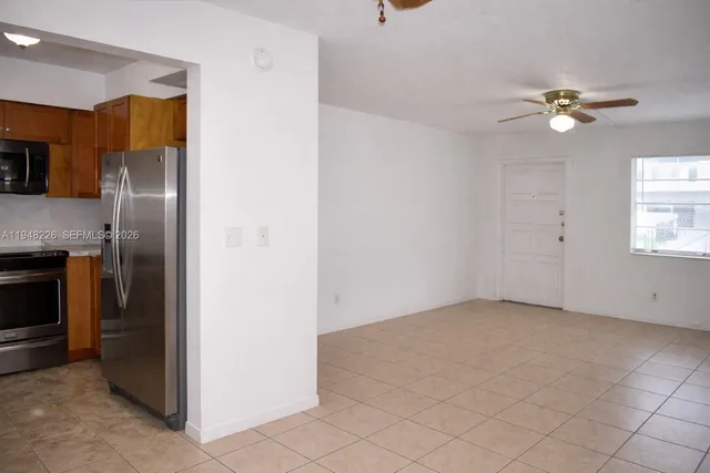 a view of a kitchen with closet and a fireplace