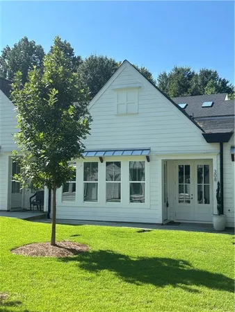 a house with swimming pool in front of it