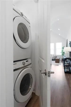 a view of a kitchen with sink washer and dryer