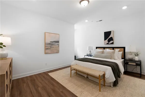 a bedroom with a bed and night stand