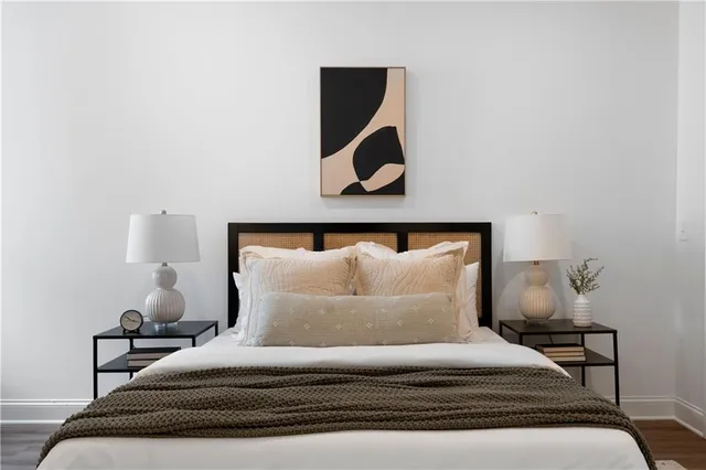 a bedroom with a bed and window