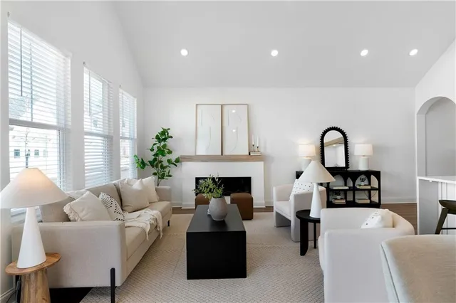 a living room with furniture and a fireplace