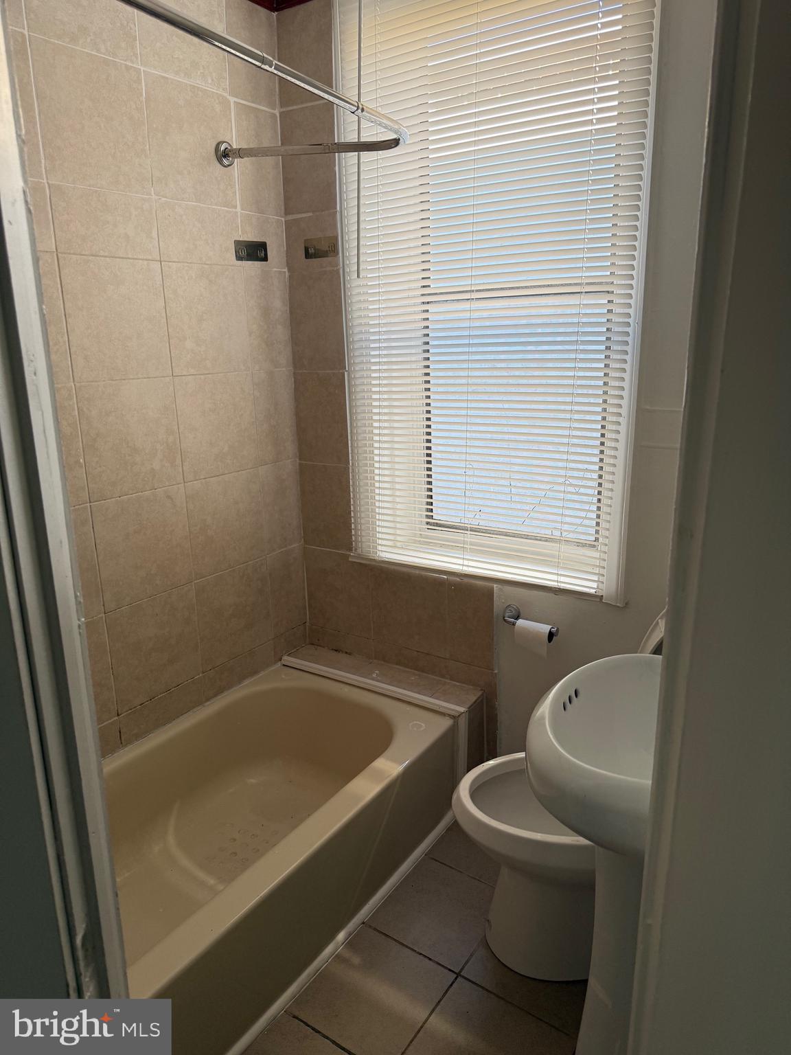 2856 Tulip Street Philadelphia, PA 19134 - Photo 9 of 13 a bathroom with a tub toilet and sink