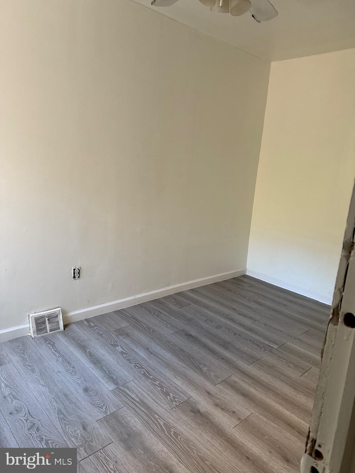 2856 Tulip Street Philadelphia, PA 19134 - Photo 10 of 13 a view of an empty room with wooden floor