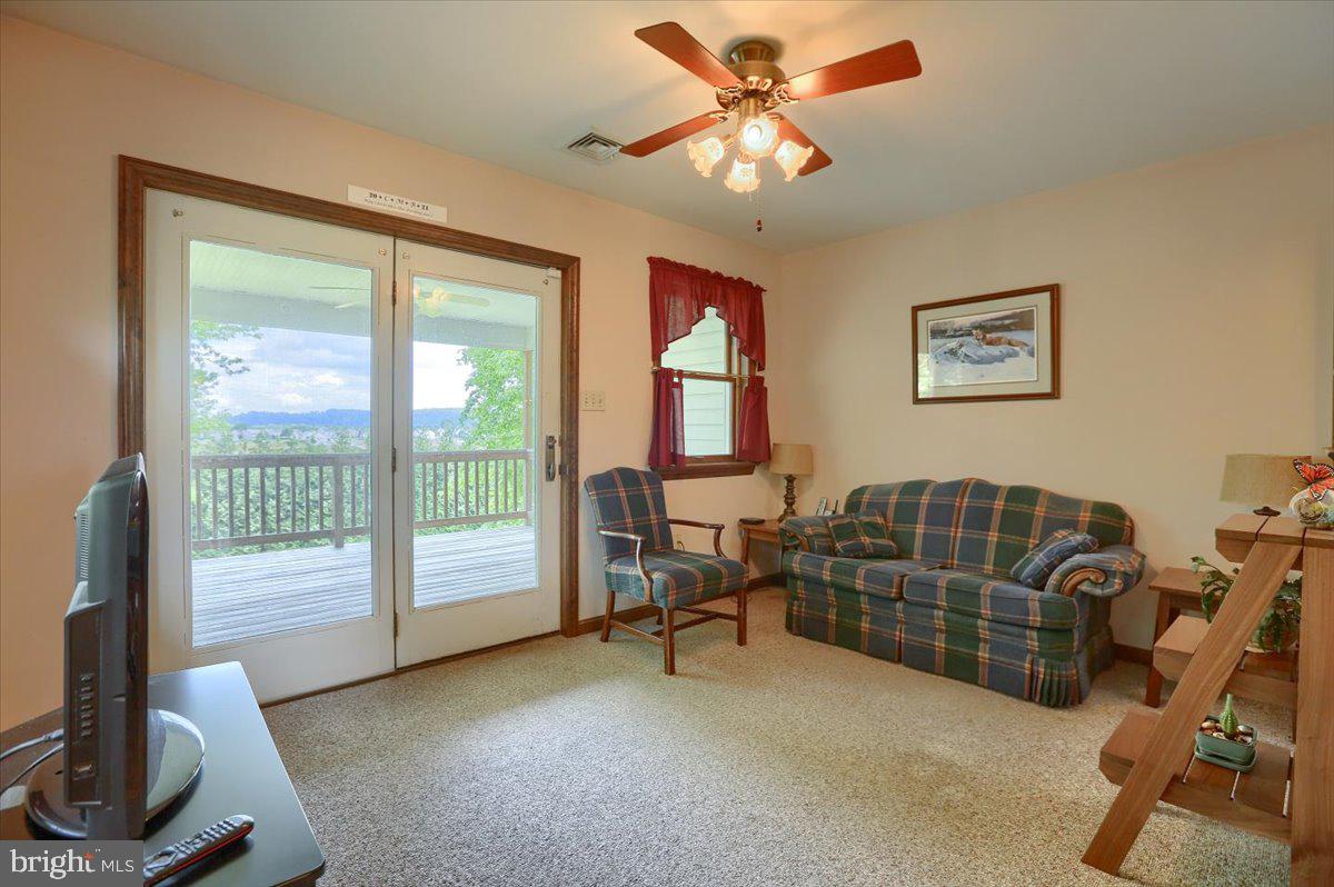 247 Rock Point Road Marietta, PA 17547 - Photo 13 of 31 sitting room off kitchen leads to deck