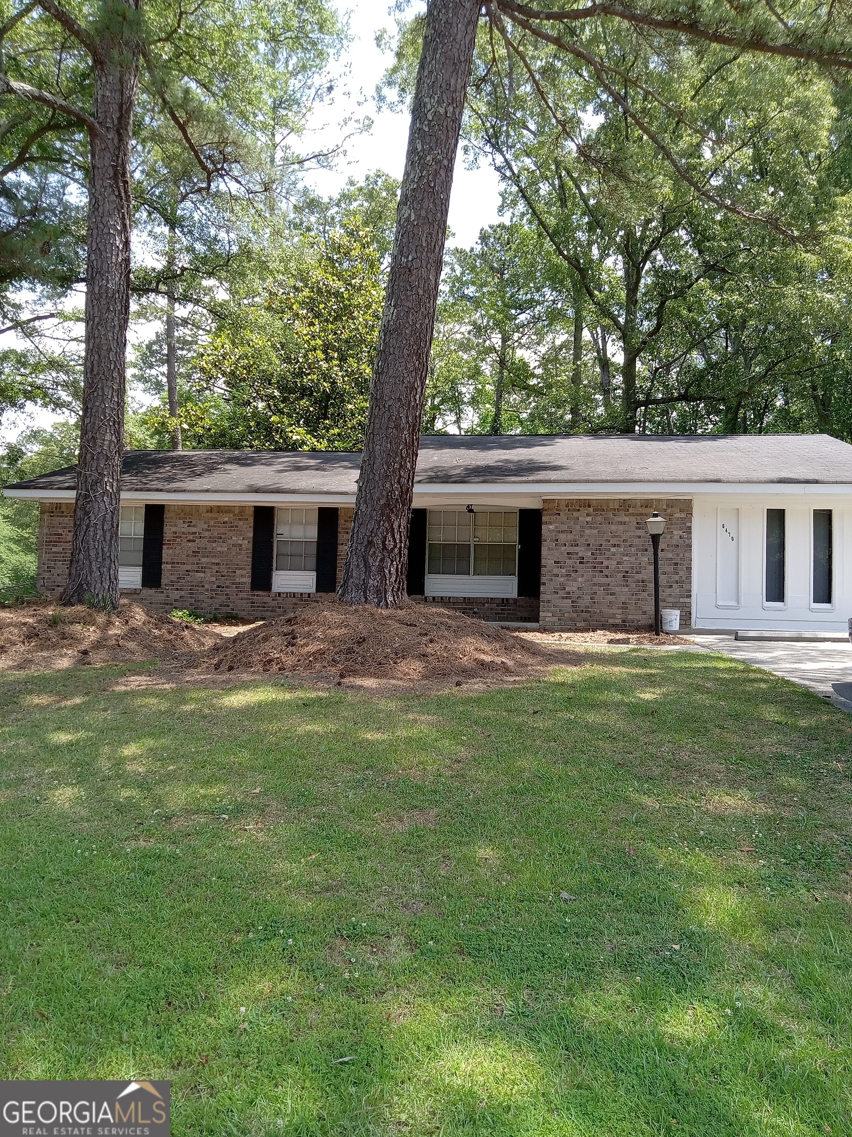6470 Connell Road South Fulton, GA 30349 - Photo 1 of 1 a backyard of a house with table and chairs
