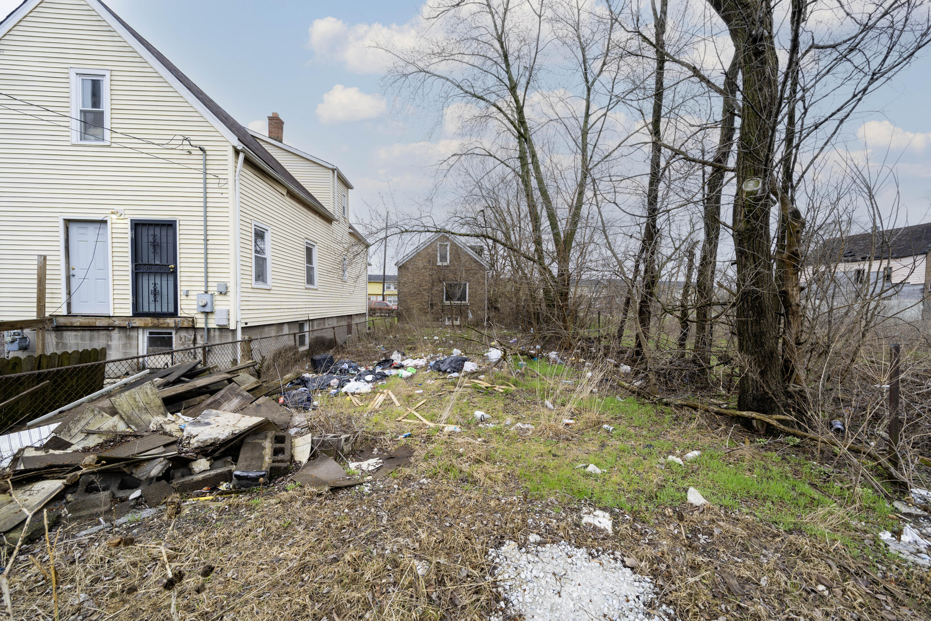 1924 Virginia Street Gary, IN 46407 - Photo 2 of 3 a backyard of a house with lots of green space