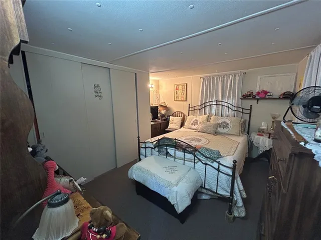 a bedroom with a bed and a table in it