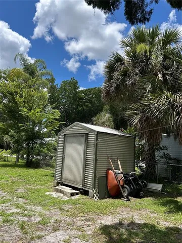 a backyard of a house with seating space