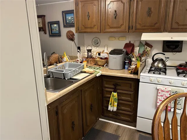 a kitchen with a stove and a sink