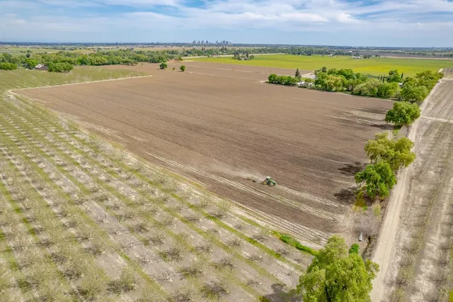 a view of a lake with houses in the back