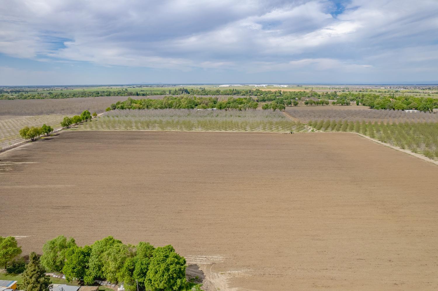 20660 Old River Road Woodland, CA 95776 - Photo 17 of 18 a view of a lake with houses in the back