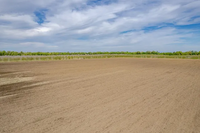 an aerial view of a city with lake view