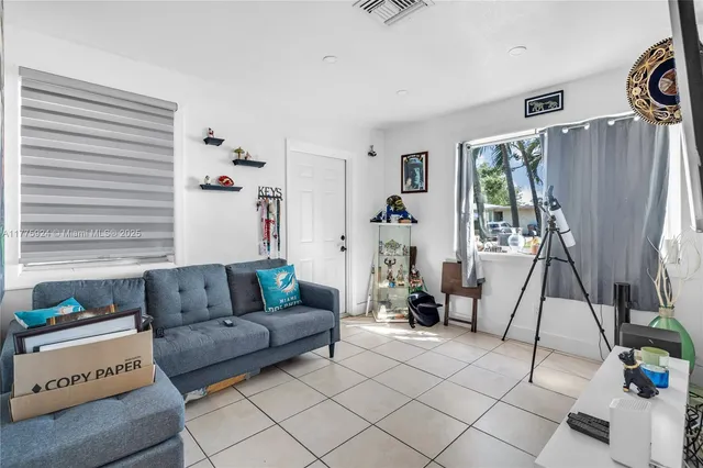 a living room with furniture and a window