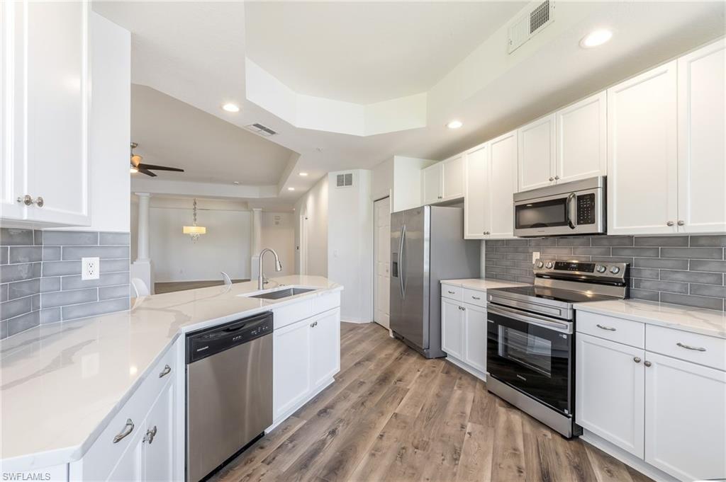 3610 Lansing Loop, Unit 103 Estero, FL 33928 - Photo 13 of 30 Kitchen to Great Room.