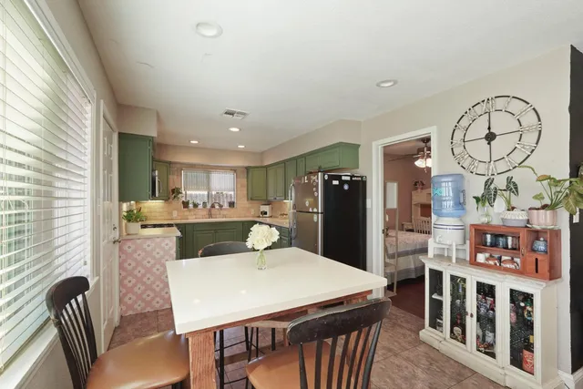 a kitchen with a sink cabinets and stainless steel appliances
