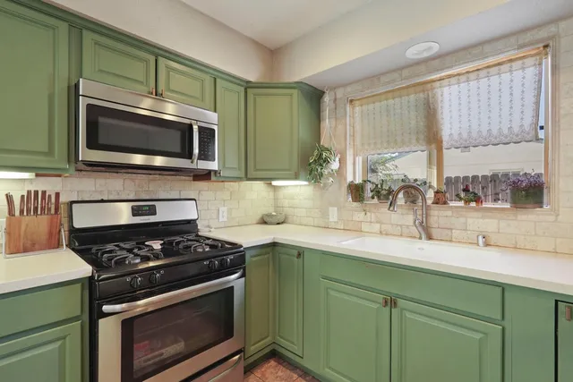 a kitchen with a stove and a microwave