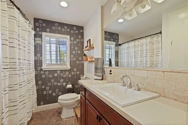 a bedroom with furniture and a wooden floor