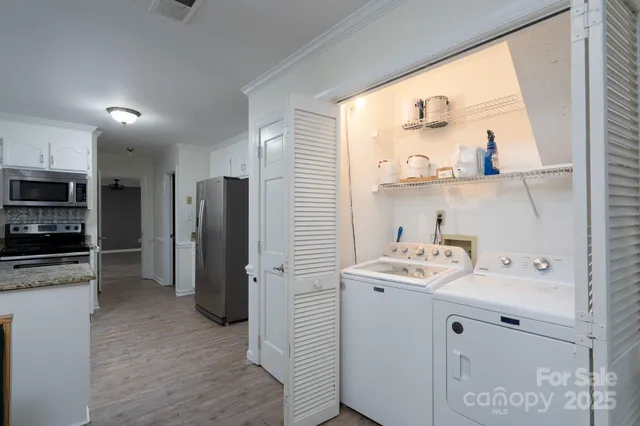 a kitchen with a sink a refrigerator and window