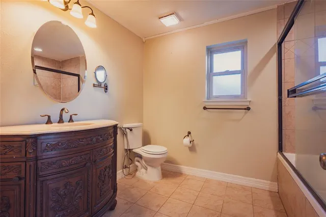 a bathroom with a glass shower door