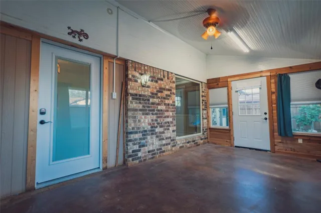 a view of an empty room with a window