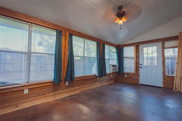 a view of a livingroom with furniture staircase and front door
