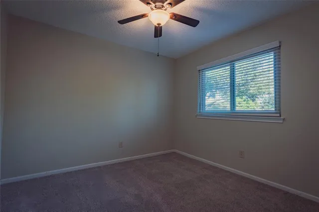a view of a pathway of a house with a yard
