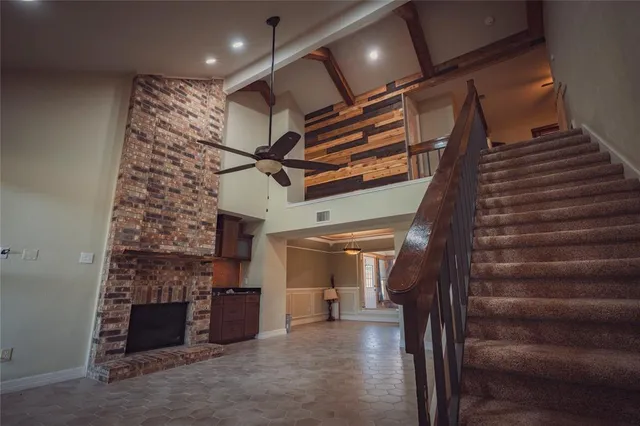 a view of an empty room with stairs