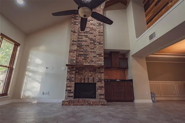 a view of a hallway with wooden shelves