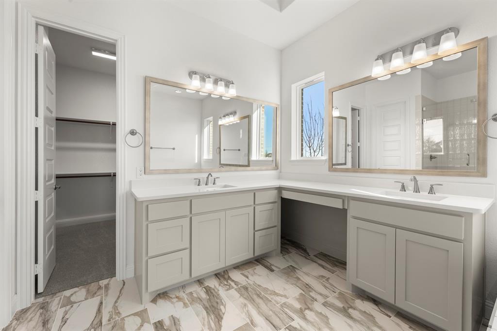 2006 Wickersham Road Rockwall, TX 75087 - Photo 17 of 33 a spacious bathroom with a double vanity sink mirror and
